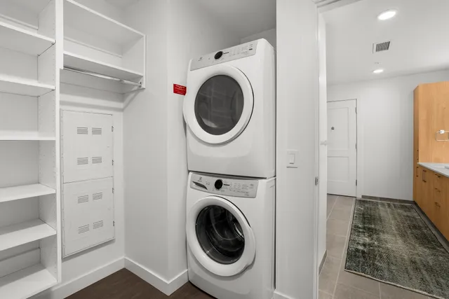 a view of a hallway with washer and dryer