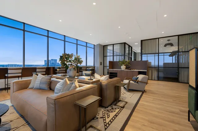 a living room with fireplace furniture and a wooden floor