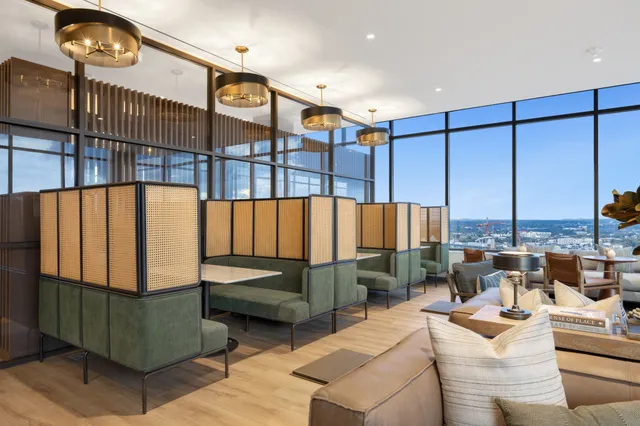 a balcony with furniture and a potted plant