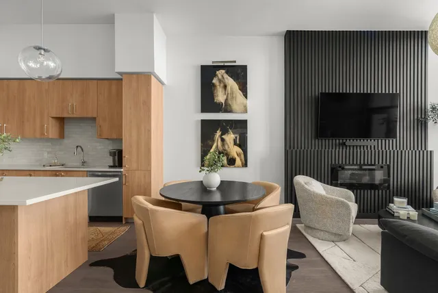 a dining room with furniture and window