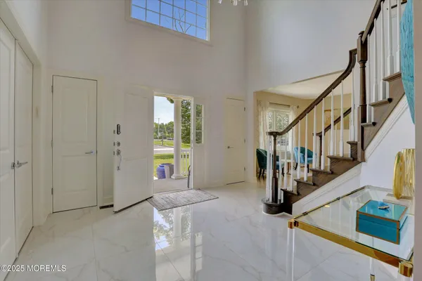 a living room with furniture and painting on the wall