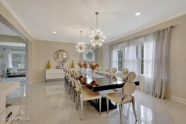 a kitchen with stainless steel appliances a sink a stove a refrigerator cabinets and a counter top space