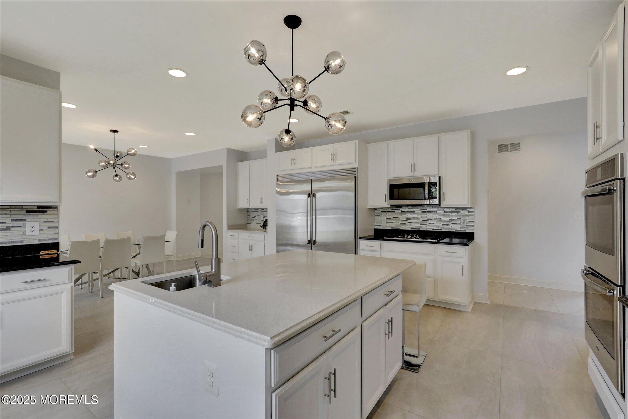 1 Country Club Drive Deal, NJ 07723 - Photo 25 of 65 a kitchen that has a lot of cabinets in it and appliances