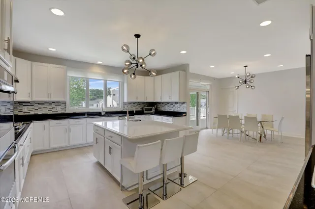 a living room with furniture rug and window