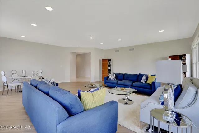 a view of living room with furniture and window