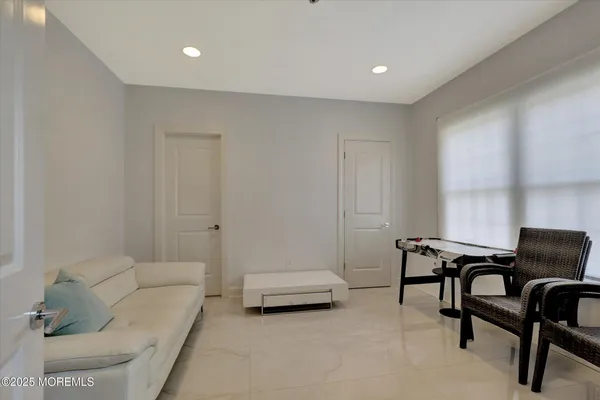 a en suite bathroom with double sink and a mirror