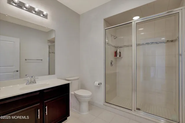 a bedroom with two beds and a window