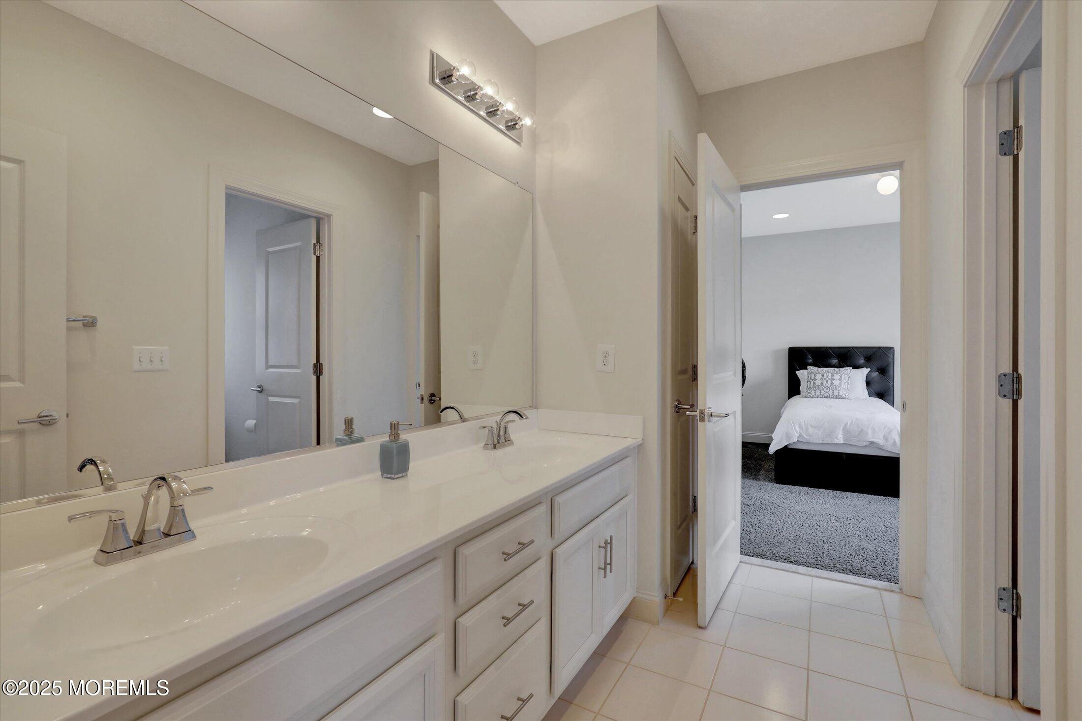 1 Country Club Drive Deal, NJ 07723 - Photo 47 of 65 a en suite bathroom with double sink and a mirror