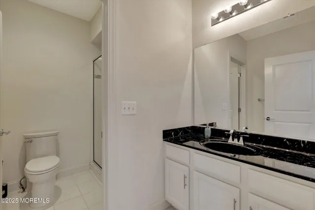 an aerial view of a house with a yard basket ball court and outdoor seating