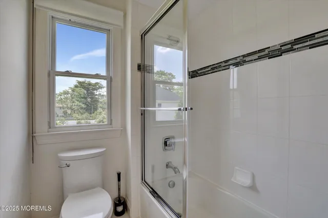 an aerial view of a house with garden space and street view