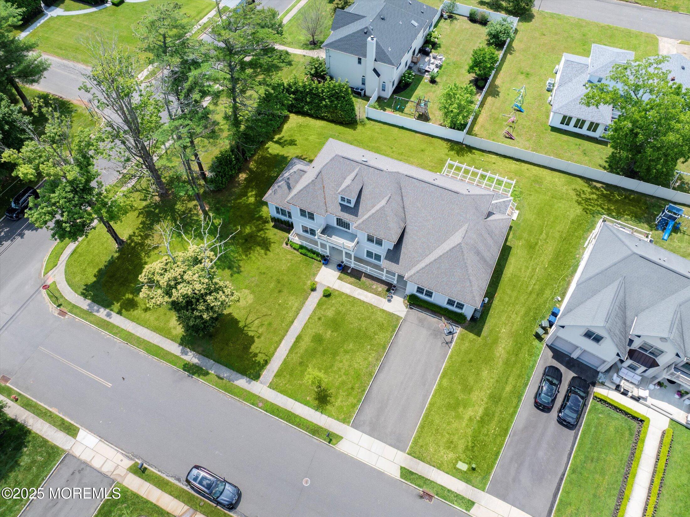 1 Country Club Drive Deal, NJ 07723 - Photo 7 of 65 an aerial view of a house with a garden and swimming pool
