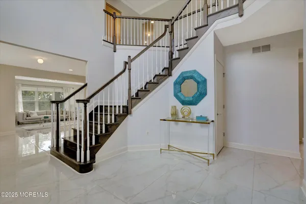 a view of an entryway with staircase