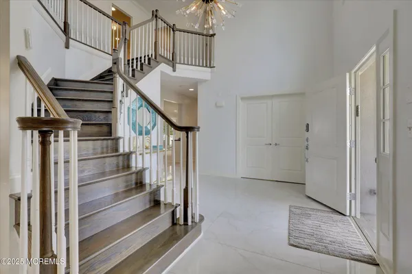 a view of an entryway with wooden floor and windows