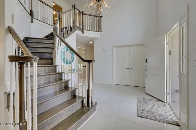 a view of an entryway with wooden floor and windows