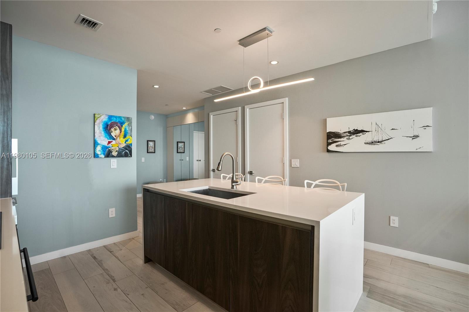 480 Northeast 31st Street, Unit 3906 Miami, FL 33137 - Photo 20 of 38 a bathroom with a sink and a mirror