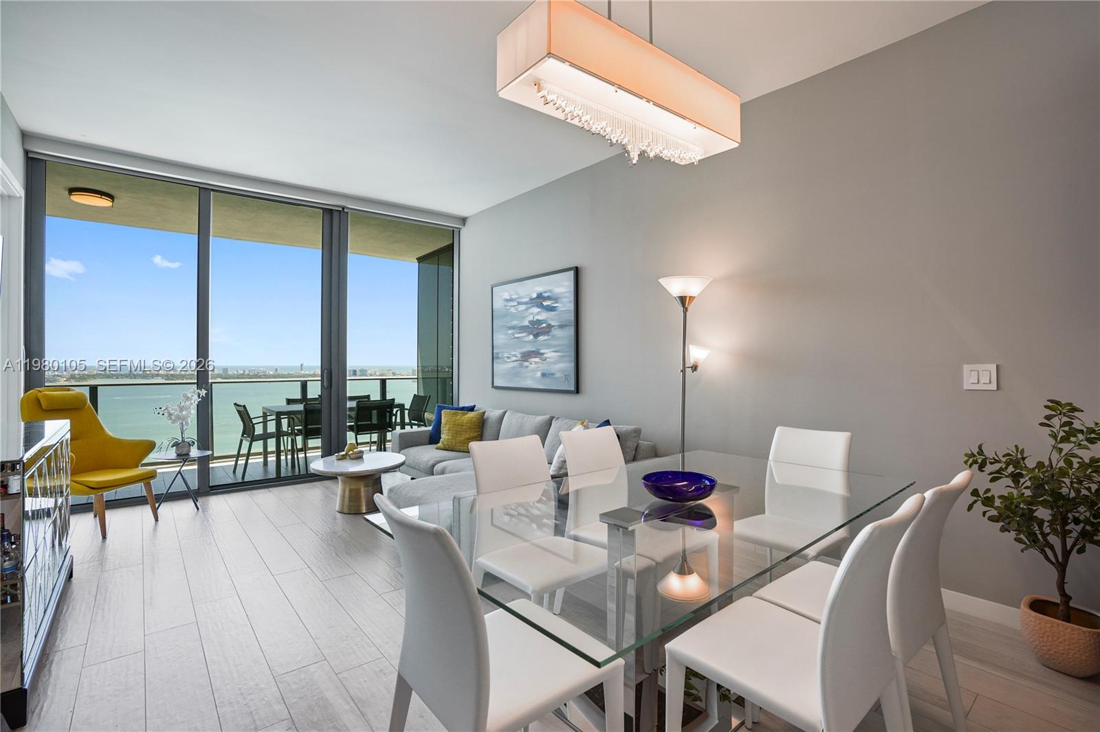 480 Northeast 31st Street, Unit 3906 Miami, FL 33137 - Photo 3 of 38 a living room with furniture and a large window