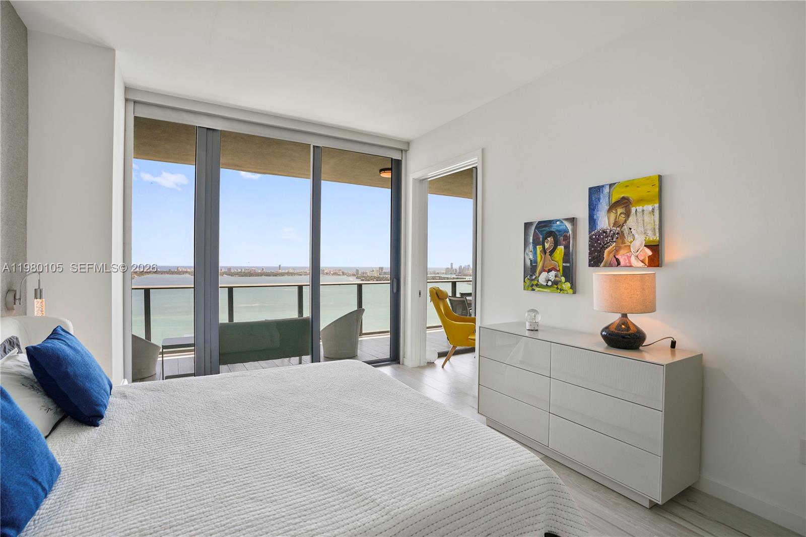 480 Northeast 31st Street, Unit 3906 Miami, FL 33137 - Photo 33 of 38 a bedroom with a large bed and a window