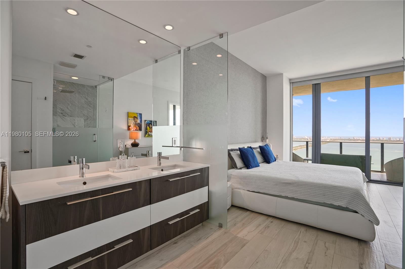 480 Northeast 31st Street, Unit 3906 Miami, FL 33137 - Photo 35 of 38 a bedroom with a bed and large windows