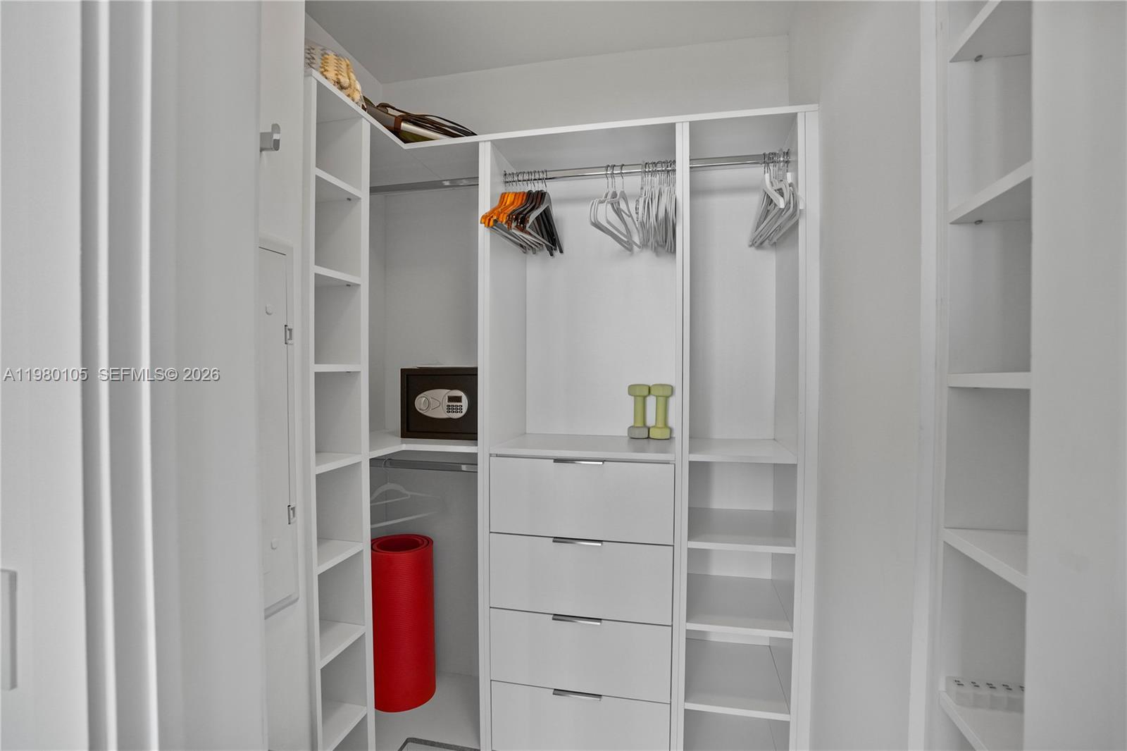 480 Northeast 31st Street, Unit 3906 Miami, FL 33137 - Photo 37 of 38 a view of walk in closet with empty racks