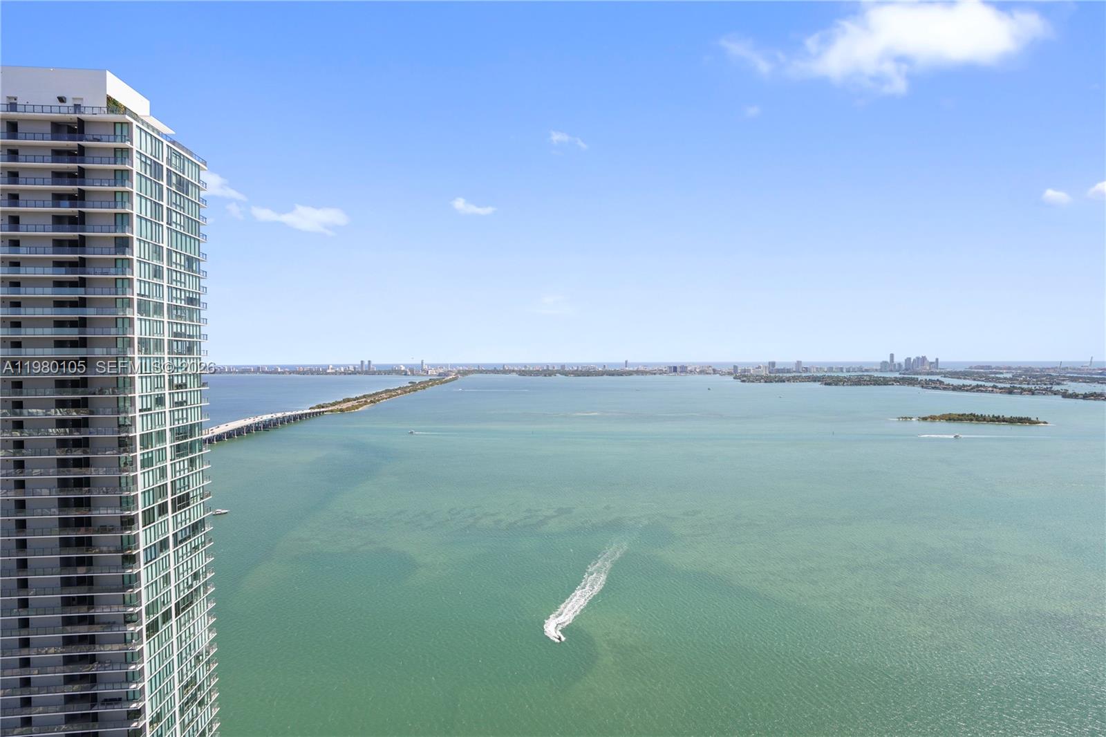 480 Northeast 31st Street, Unit 3906 Miami, FL 33137 - Photo 8 of 38 a view of lake with tall building