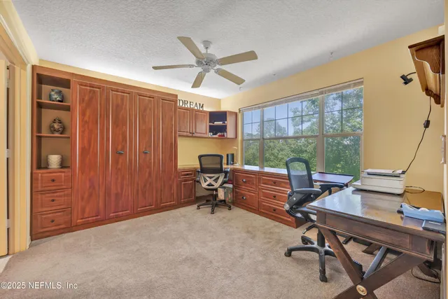 a view of a room with a furniture and a livingroom