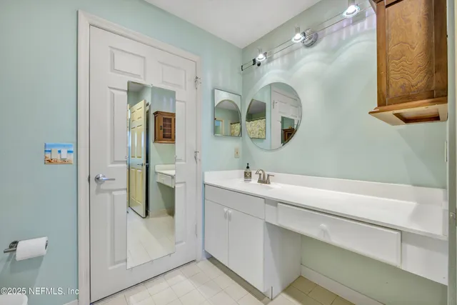 a view of a room with lots of white furniture