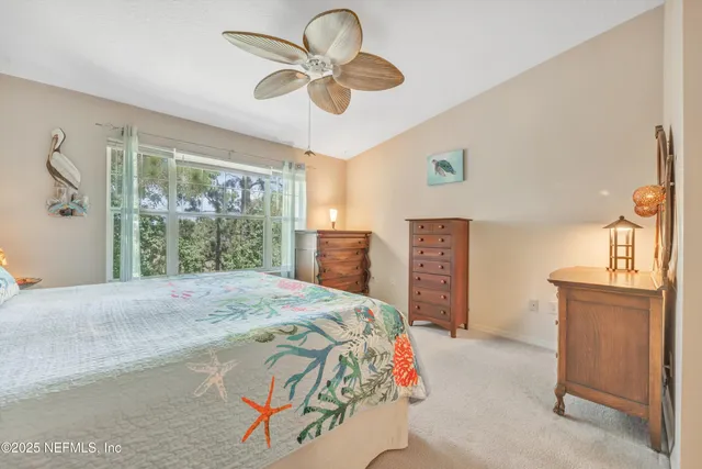 a bedroom with a bed and cabinets