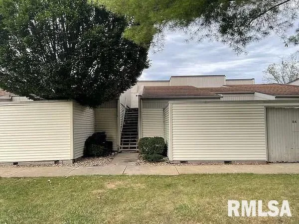 a view of a backyard of the house