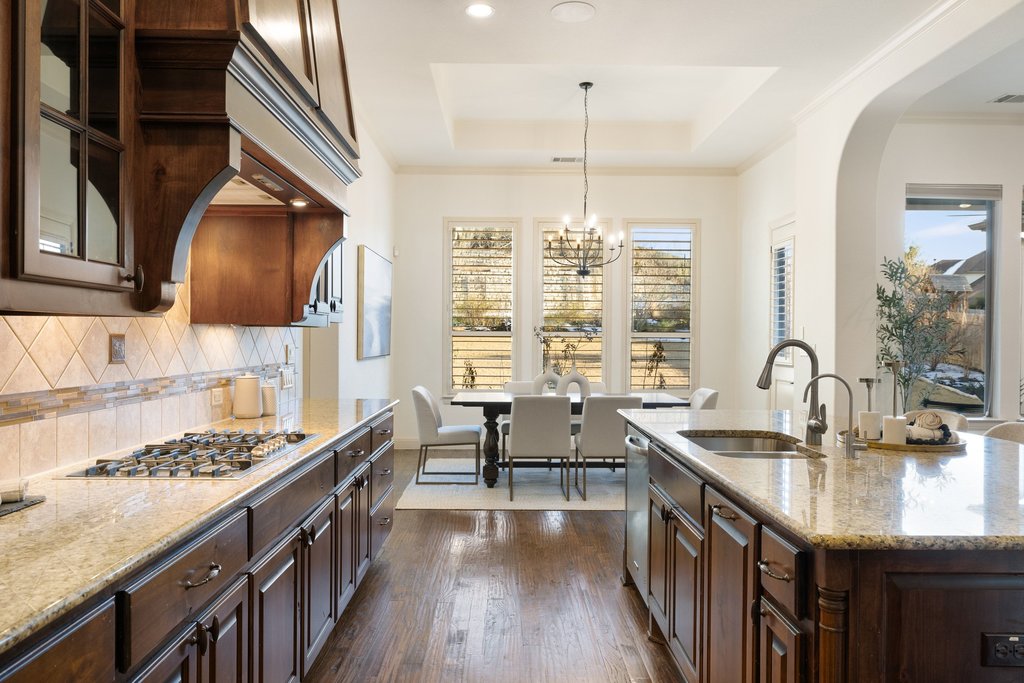 5804 Davenport Divide Road Austin, TX 78738 - Photo 14 of 40 a kitchen with sink stove and cabinets