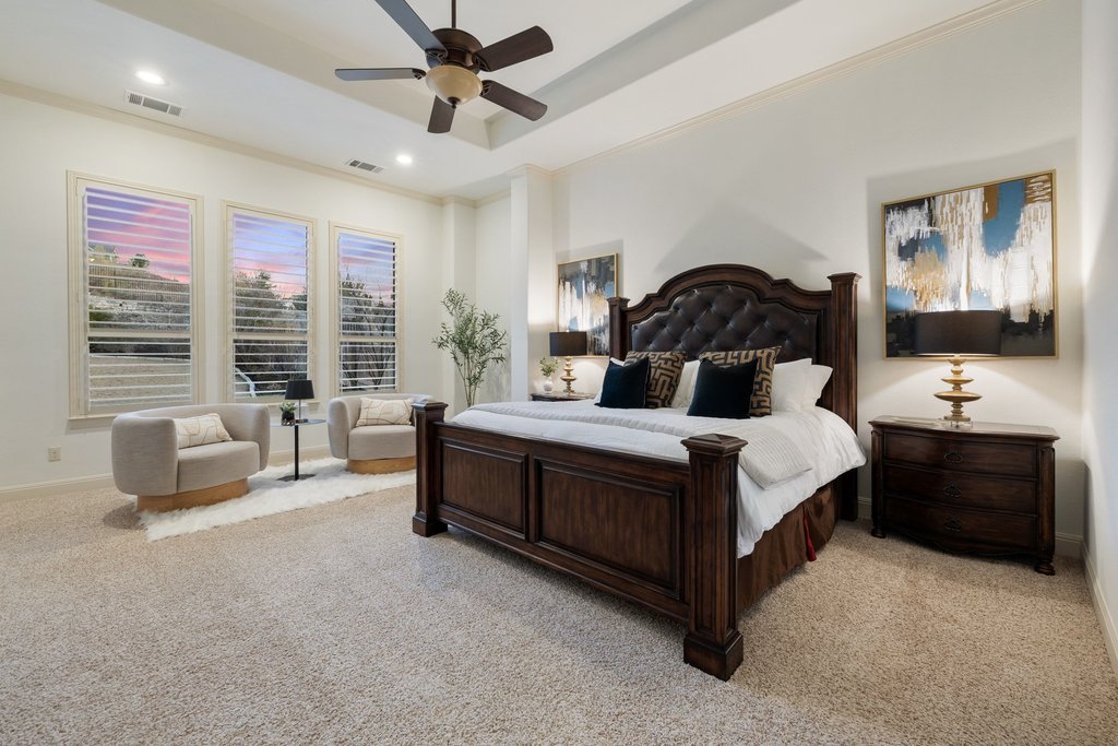 5804 Davenport Divide Road Austin, TX 78738 - Photo 17 of 40 a bedroom with a bed and a couch