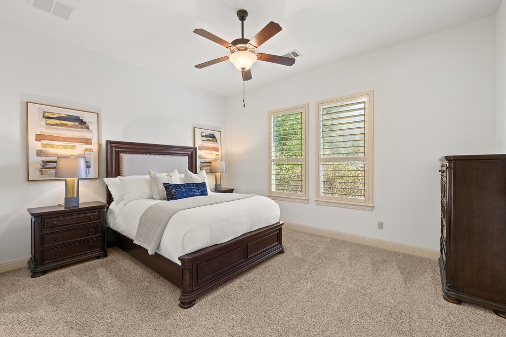 5804 Davenport Divide Road Austin, TX 78738 - Photo 22 of 40 a bedroom with bed and window