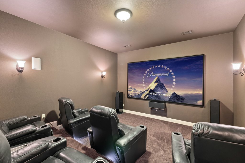 5804 Davenport Divide Road Austin, TX 78738 - Photo 26 of 40 a living room with furniture and a flat screen tv