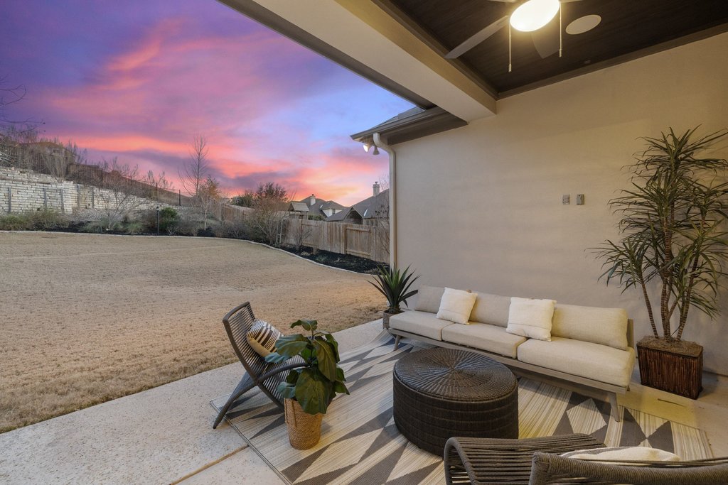 5804 Davenport Divide Road Austin, TX 78738 - Photo 33 of 40 a view of a patio with couches table and chairs and potted plants