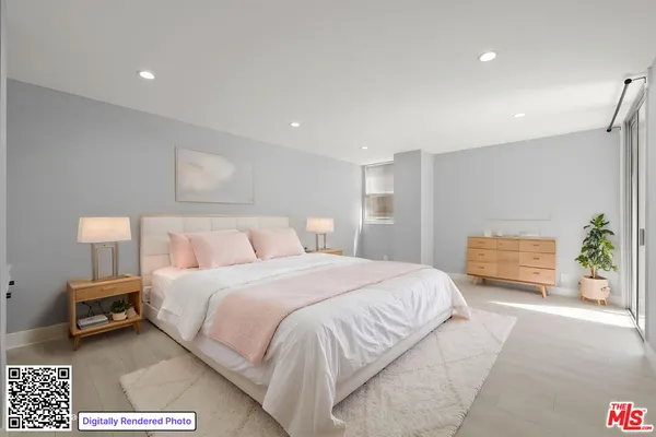 a bedroom with a bed and a couch
