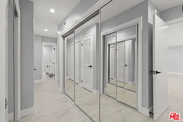a bathroom with a shower and a glass door