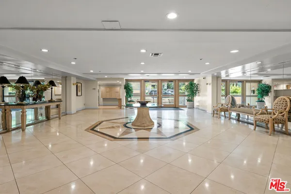 a room with lots of table and chairs