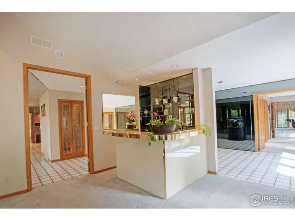 a view of a living room and kitchen