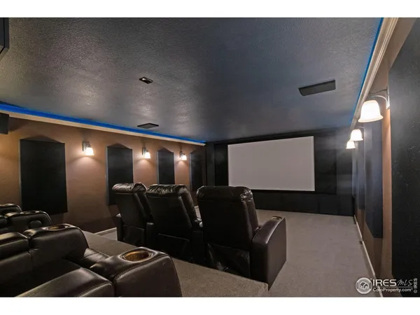 a view of empty room with wooden floor and furniture