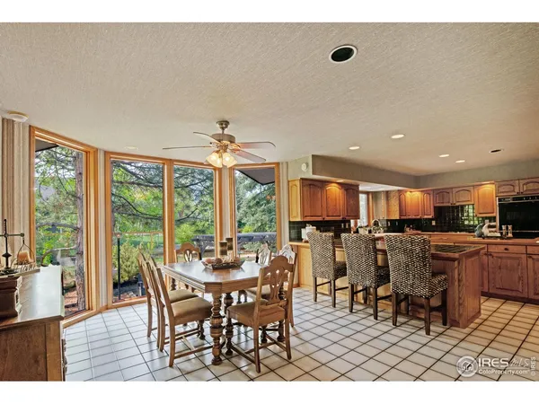 a kitchen with stainless steel appliances granite countertop a sink a stove and cabinets