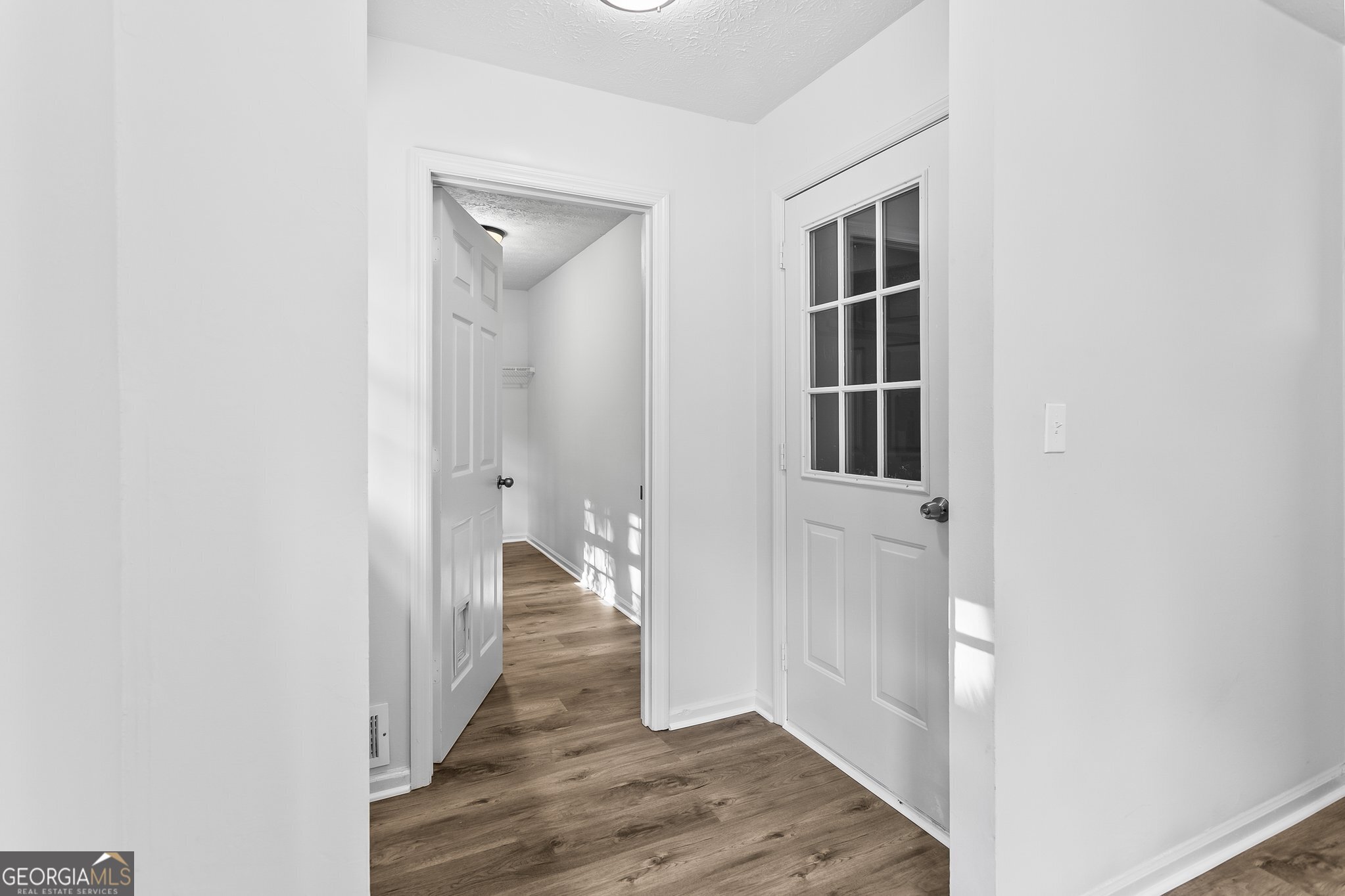 3620 Knoll Crest Trail Buford, GA 30519 - Photo 18 of 47 a view of a hallway with wooden floor and closet