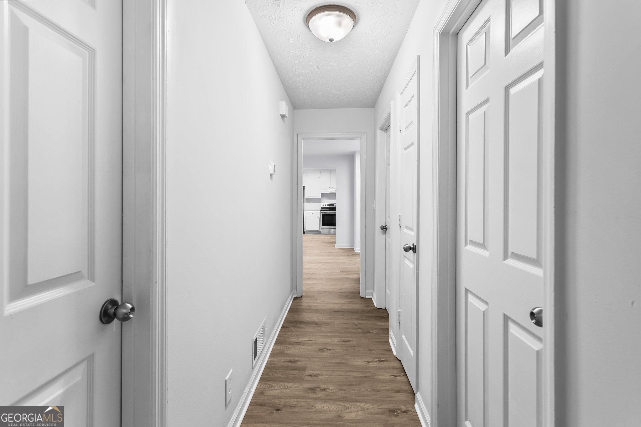 3620 Knoll Crest Trail Buford, GA 30519 - Photo 19 of 47 a view of a hallway with a wooden door