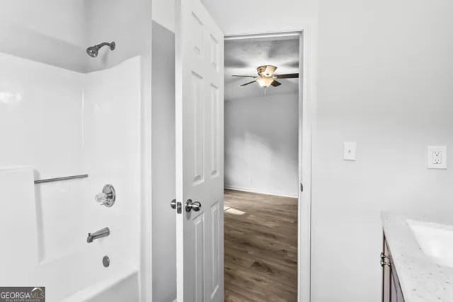 a bathroom with a glass shower door