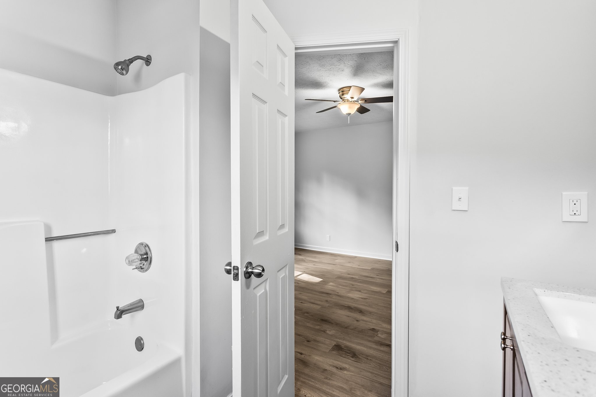 3620 Knoll Crest Trail Buford, GA 30519 - Photo 20 of 47 a bathroom with a glass shower door