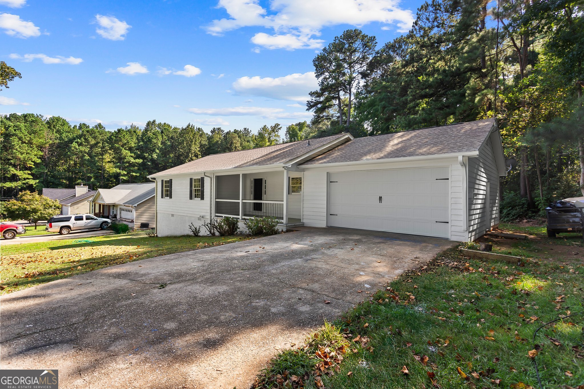 3620 Knoll Crest Trail Buford, GA 30519 - Photo 2 of 47 a view of a house with backyard and trees