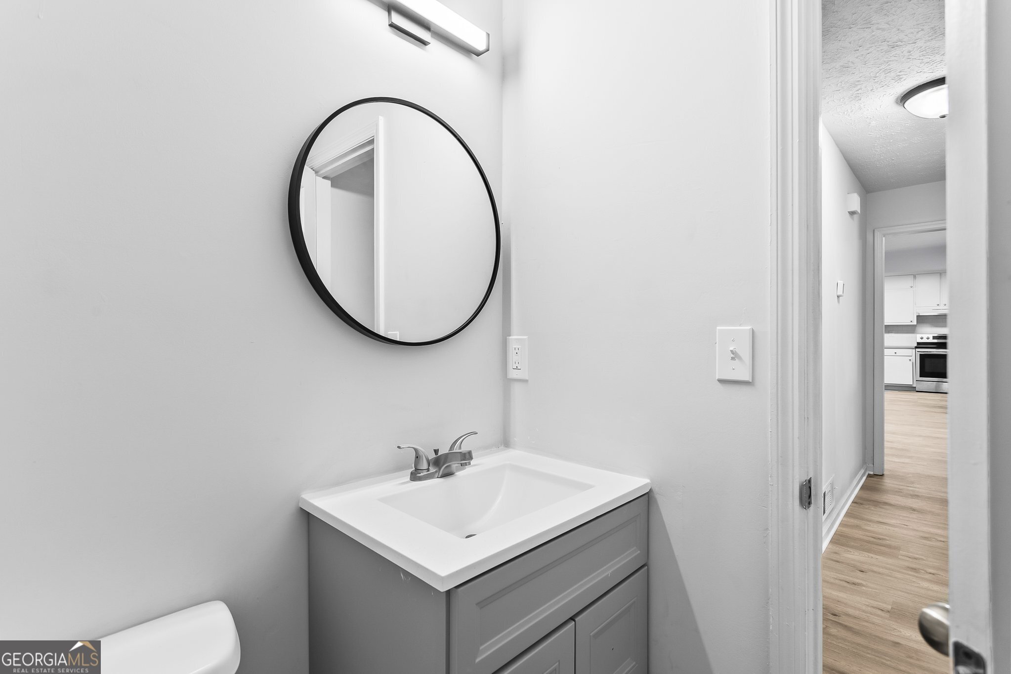 3620 Knoll Crest Trail Buford, GA 30519 - Photo 25 of 47 a bathroom with a sink and a mirror