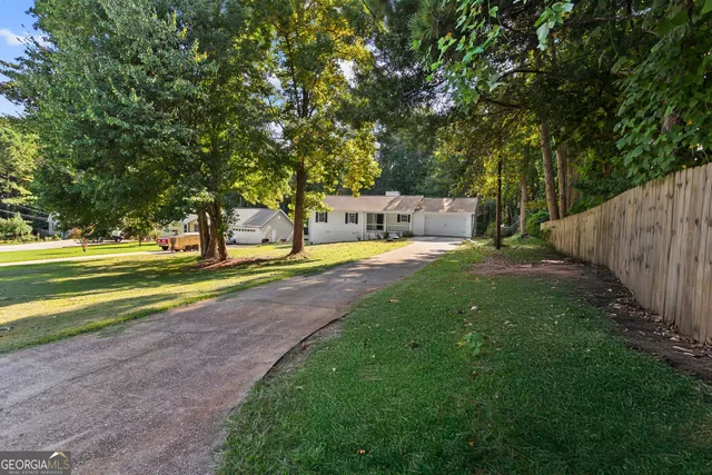 a view of a park with large trees