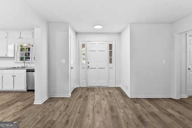 a view of wooden floor and windows in a room