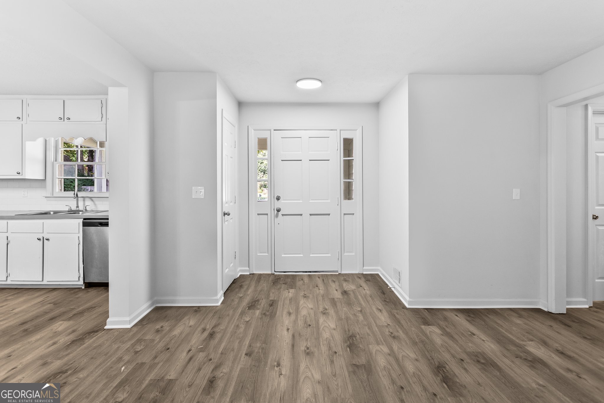 3620 Knoll Crest Trail Buford, GA 30519 - Photo 35 of 47 a view of wooden floor and windows in a room