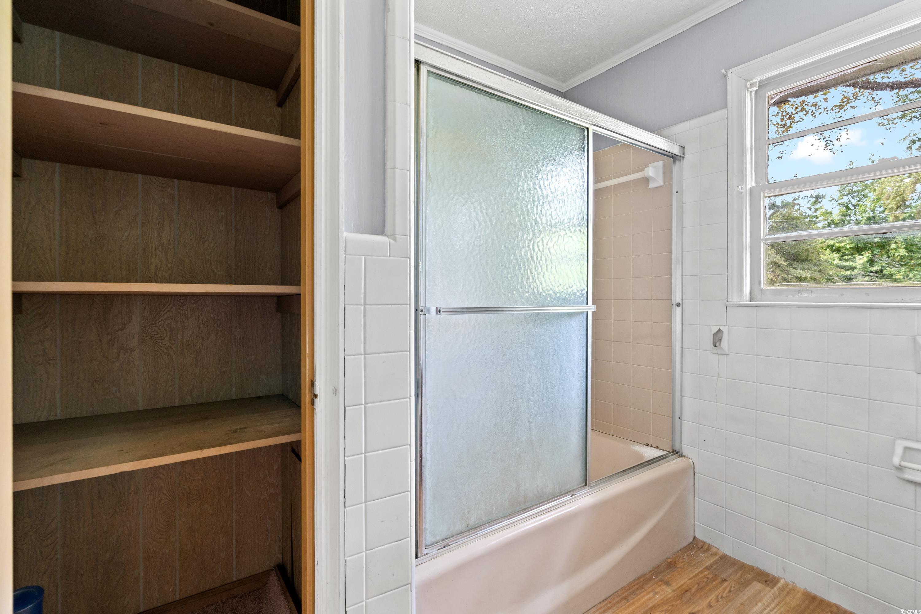 476 Live Oak Church Road Loris, SC 29569 - Photo 15 of 39 Bathroom with tile walls, enclosed tub / shower co