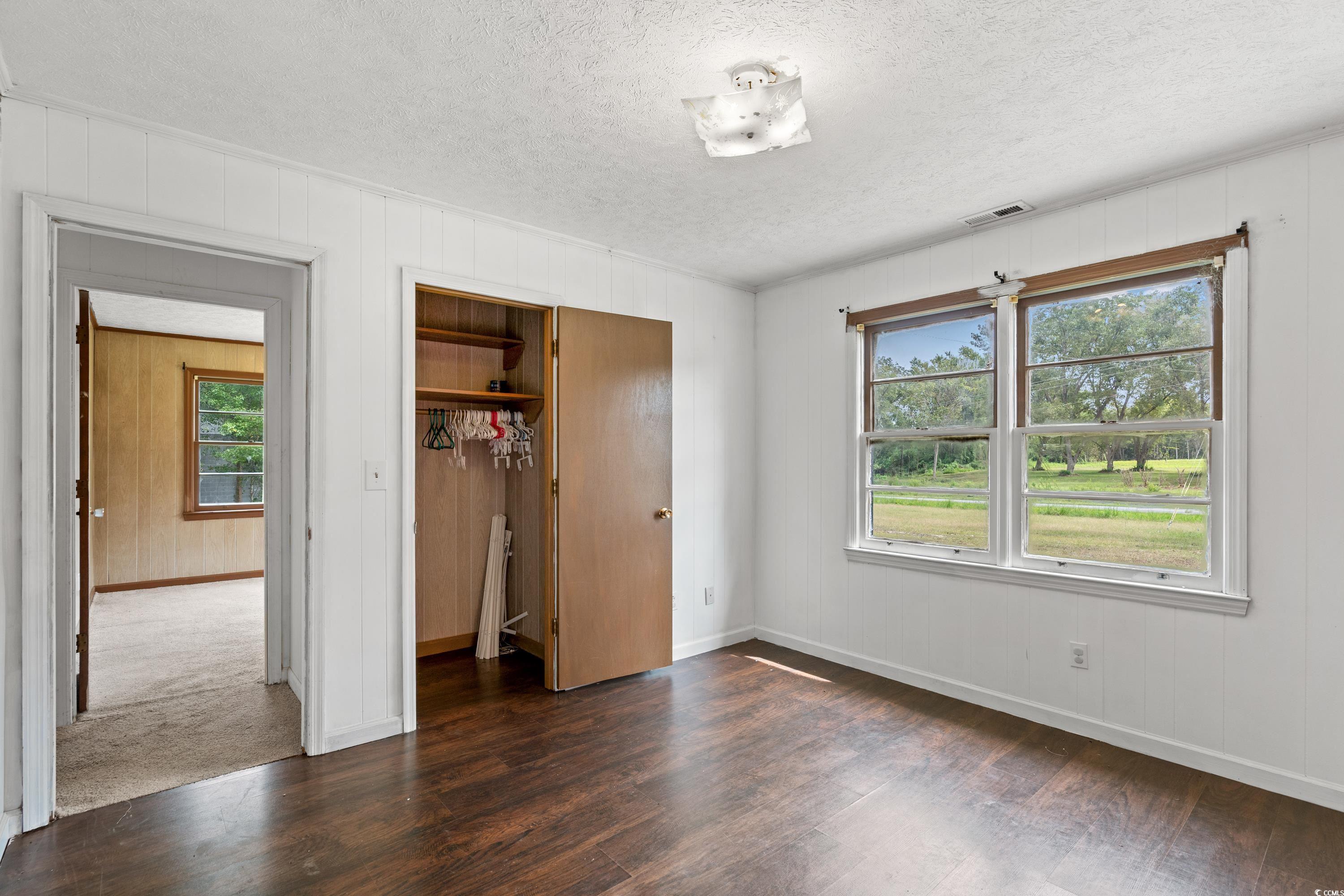 476 Live Oak Church Road Loris, SC 29569 - Photo 17 of 39 Unfurnished bedroom featuring multiple windows, a